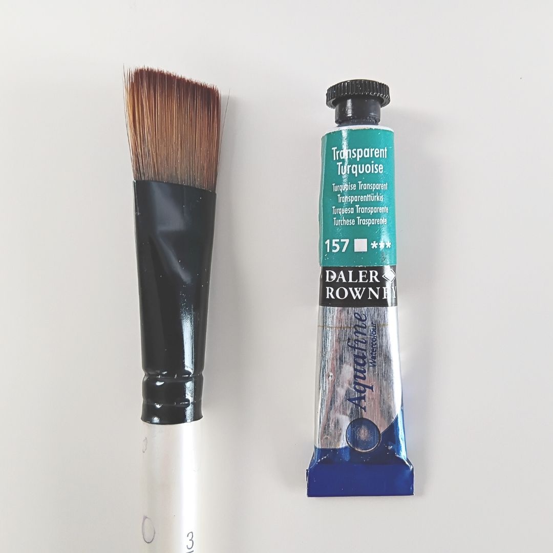 Flatlay design with brush and colour representing branding