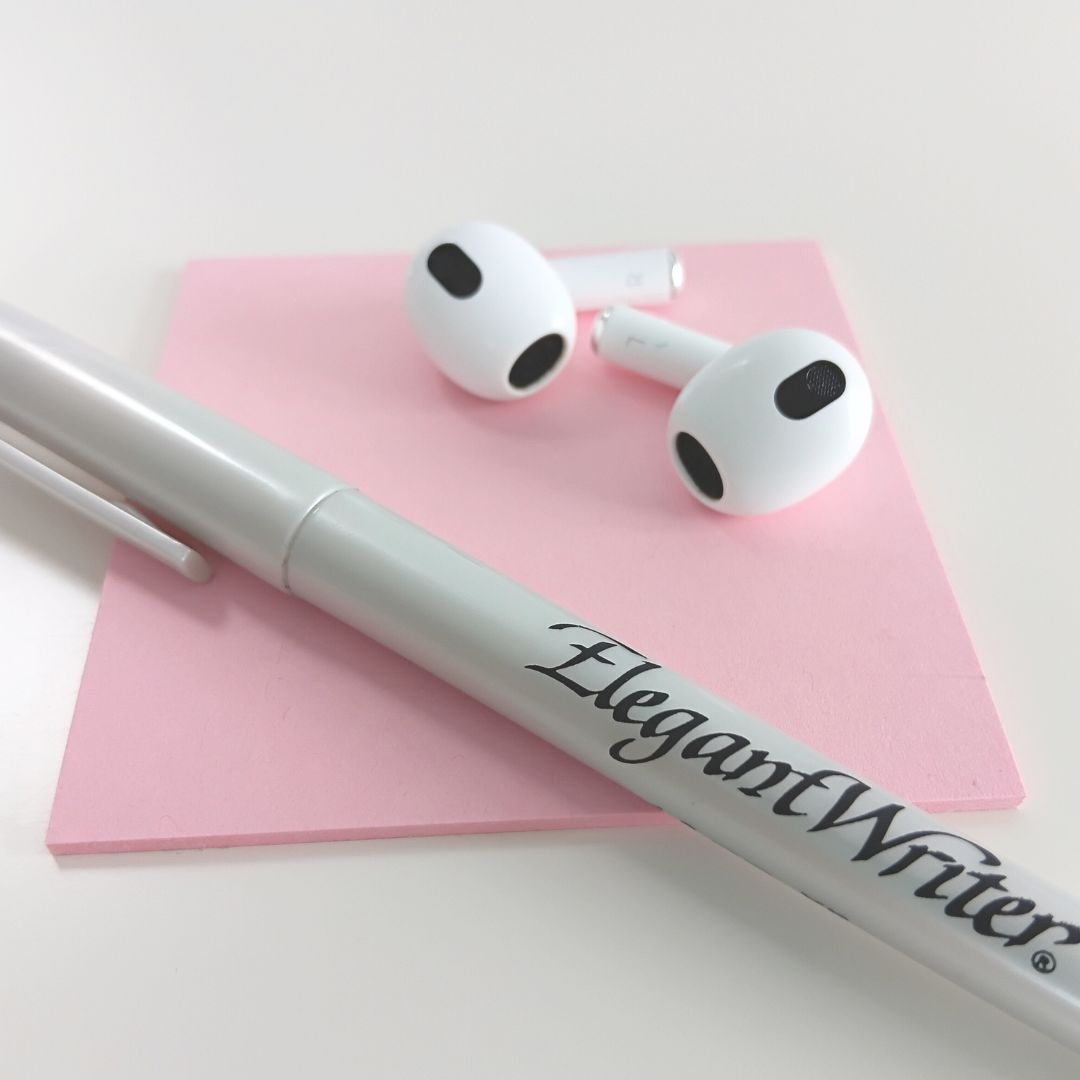 Headphones, post it and pen showing content creation strategy
