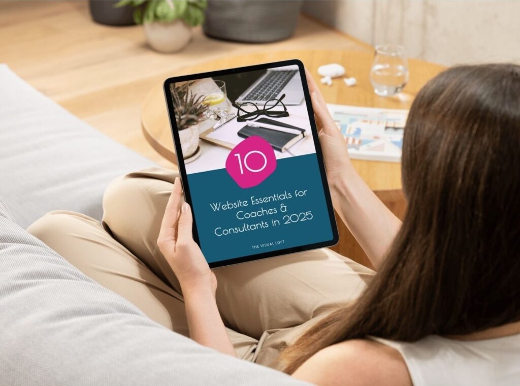 Woman holding a tablet showing the free website checklist for coaches and consultants